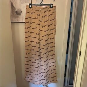 Stylish Tan Pants Printed with Confident text all over in brown. Soft and fun!